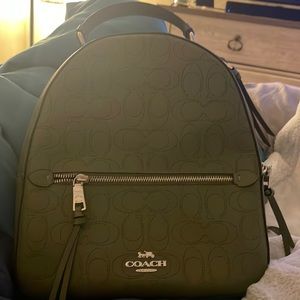 Beautiful olive green leather Coach Signature backpack